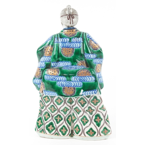  A Japanese Kutani hand painted porcelain figure modelled as a Samurai, 20th century, 30cm high.