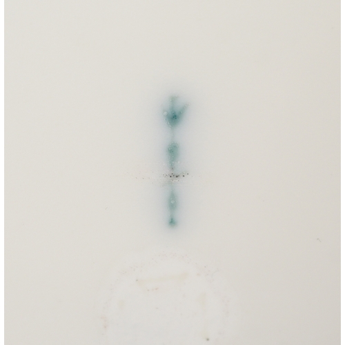  A 19th century Berlin porcelain cabinet cup and saucer hand painted with floral decoration, bearing ... 