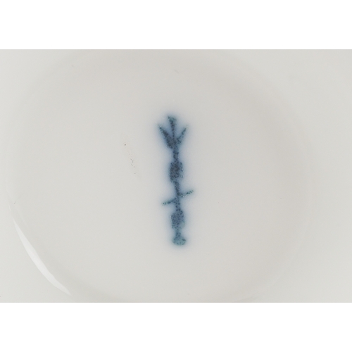  A 19th century Berlin porcelain cabinet cup and saucer hand painted with floral decoration, bearing ... 