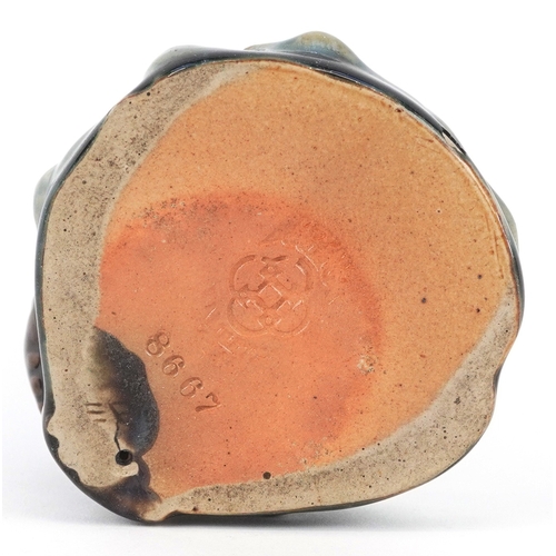  A Royal Doulton Lambeth stoneware dish modelled as a perched owl, impressed marks to the base, numbe... 