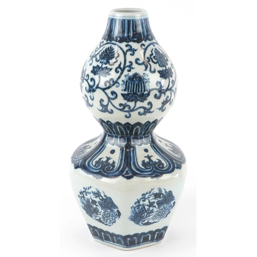122 - A Chinese blue and white porcelain double gourd vase hand painted with flower heads and mythical ani... 