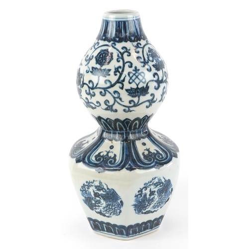 122 - A Chinese blue and white porcelain double gourd vase hand painted with flower heads and mythical ani... 
