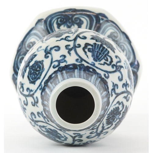 122 - A Chinese blue and white porcelain double gourd vase hand painted with flower heads and mythical ani... 