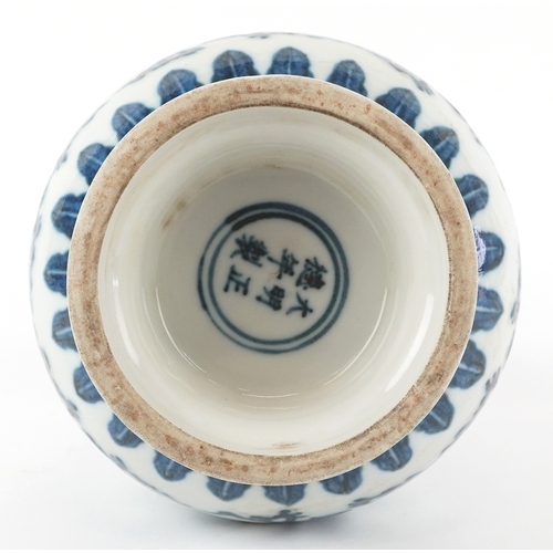 121 - A Chinese blue and white porcelain bottleneck vase with ears hand painted with pseudo Arabic script ... 