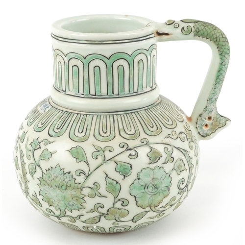 164 - A Chinese porcelain ewer with fish handle, hand painted with flower heads and scrolling vines, six f... 