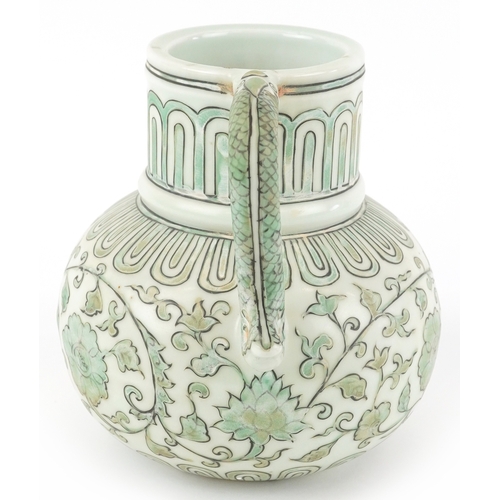 164 - A Chinese porcelain ewer with fish handle, hand painted with flower heads and scrolling vines, six f... 