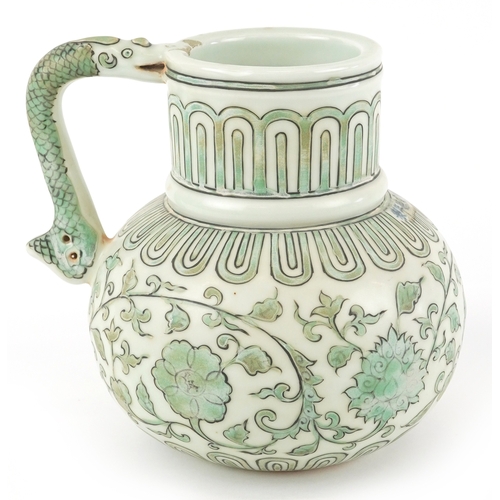 164 - A Chinese porcelain ewer with fish handle, hand painted with flower heads and scrolling vines, six f... 