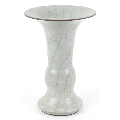 166 - A Chinese porcelain Gu beaker vase having a crackle glaze, 19cm high.