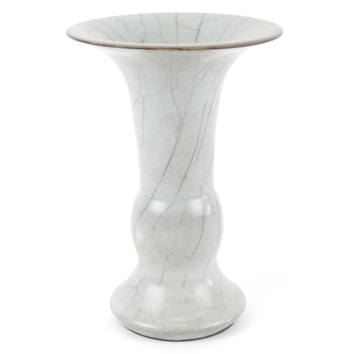 166 - A Chinese porcelain Gu beaker vase having a crackle glaze, 19cm high.