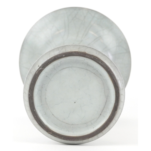 166 - A Chinese porcelain Gu beaker vase having a crackle glaze, 19cm high.