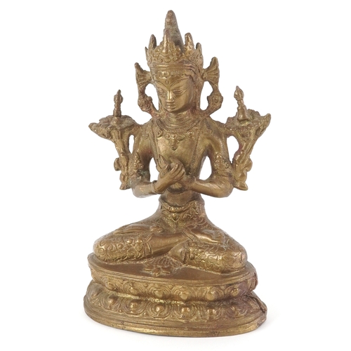 170 - A Chino Tibetan gilt bronze figure of a Buddha, 18cm high.