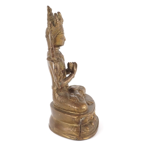170 - A Chino Tibetan gilt bronze figure of a Buddha, 18cm high.