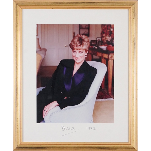 638 - A signed colour photograph of Diana, Princess of Wales dated 1993, within a gilt frame, 39cm x 30cm ... 