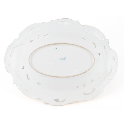32 - A Meissen porcelain gilded and pierced oval centrepiece bowl with hand painted floral decoration, be... 