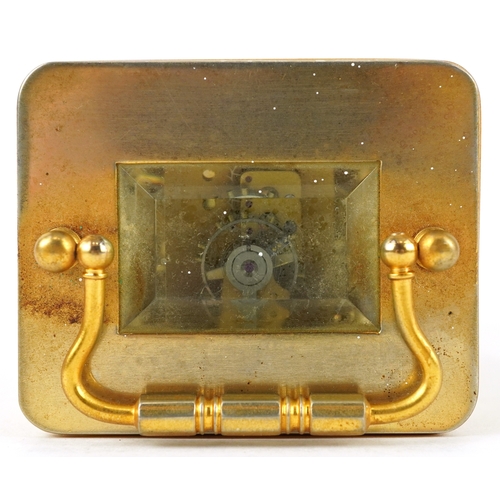 156 - A brass cased carriage clock having bevelled glass with enamelled dial and Roman numerals, 11cm high... 