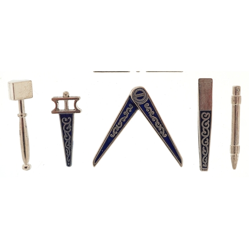 A cased set of miniature masonic working tools, the case 10cm wide.