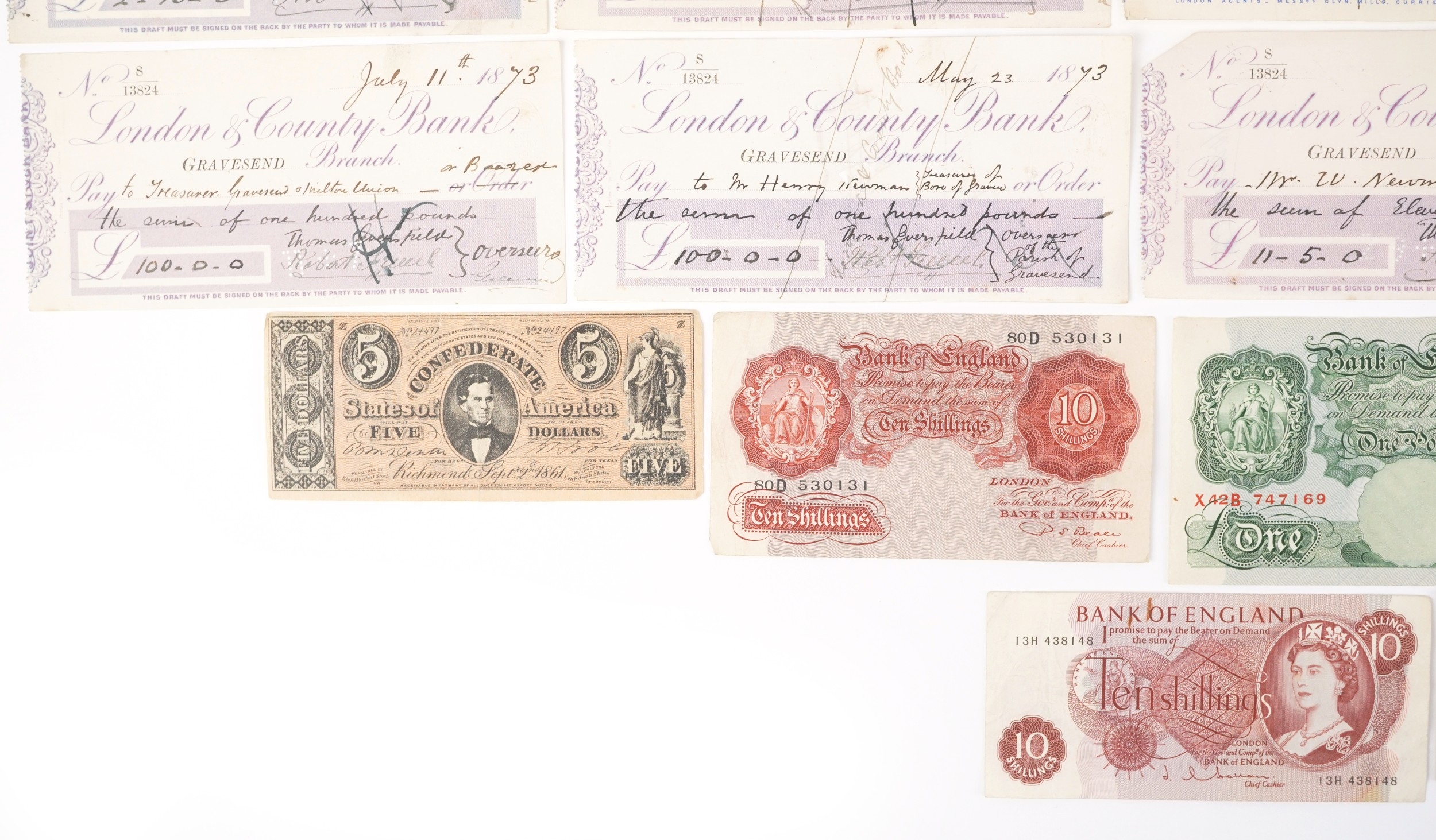 A small quantity of vintage British banknotes and 19th century cheques ...