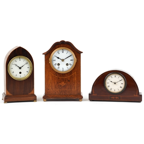 154 - Three Edwardian mahogany mantle clocks, each having a white enamelled dial and black Roman numerals,... 