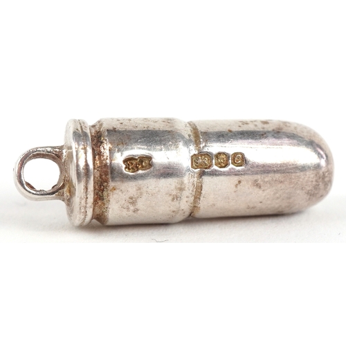A silver pendant in the form of a bullet, London 1977, 2.2cm high, 12.2g.