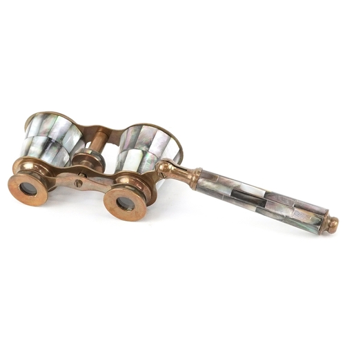 55 - A pair of 20th century mother of pearl opera glasses, 10cm wide.