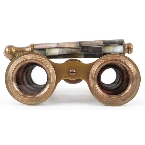 55 - A pair of 20th century mother of pearl opera glasses, 10cm wide.