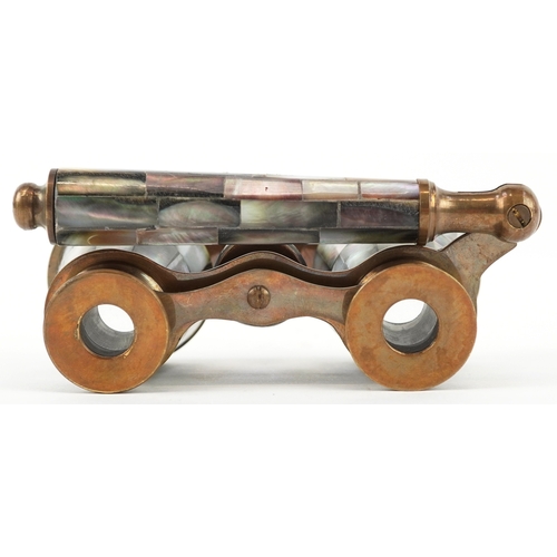 55 - A pair of 20th century mother of pearl opera glasses, 10cm wide.