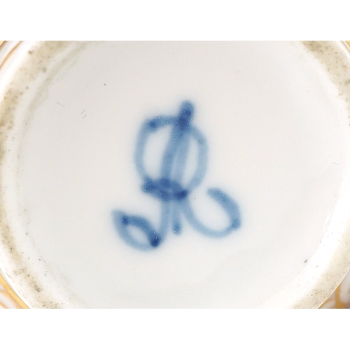 36 - A 19th century porcelain twin handled chocolate cup and cover hand painted with panels depicting a c... 