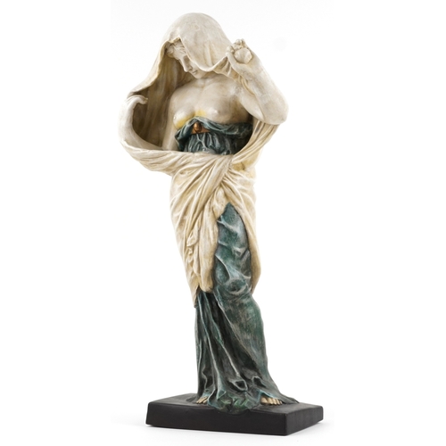 311 - A large pottery figure of a semi nude maiden, 64cm high.