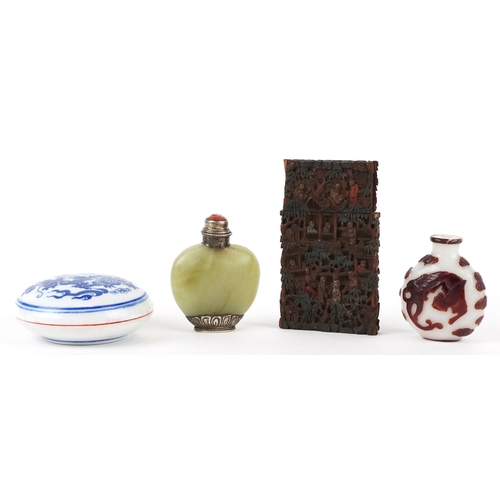 137 - A Chinese green stone snuff bottle with silver plated mounts together with a carved boxwood card cas... 
