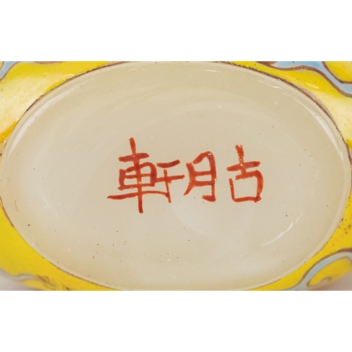 135 - Five Chinese glass snuff bottles and stoppers, each with hand painted decoration including dragons a... 