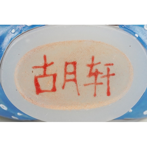 135 - Five Chinese glass snuff bottles and stoppers, each with hand painted decoration including dragons a... 