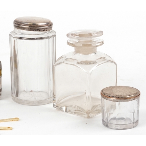 47 - An early 19th century rosewood workbox with fitted interior, glass jars and secret drawer, the hinge... 