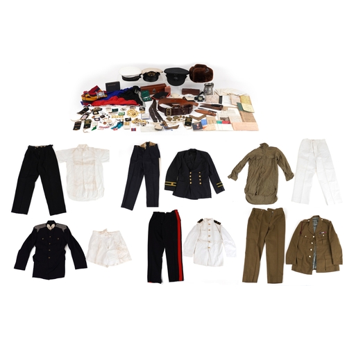 743 - A collection of military interest uniforms, paperwork, cap badges, hats and other militaria includin... 