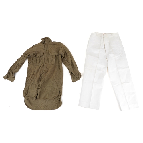 743 - A collection of military interest uniforms, paperwork, cap badges, hats and other militaria includin... 