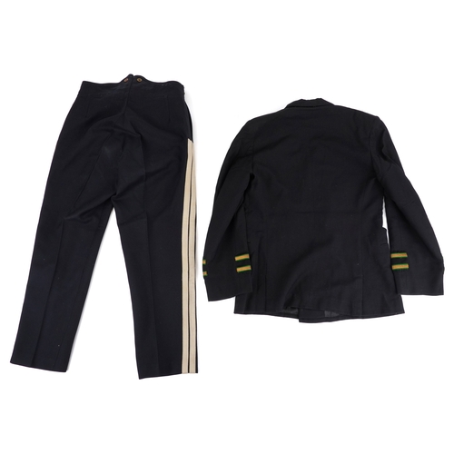 743 - A collection of military interest uniforms, paperwork, cap badges, hats and other militaria includin... 