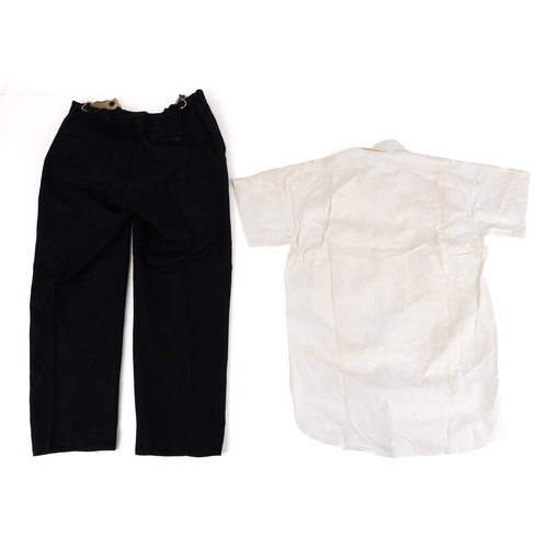 743 - A collection of military interest uniforms, paperwork, cap badges, hats and other militaria includin... 