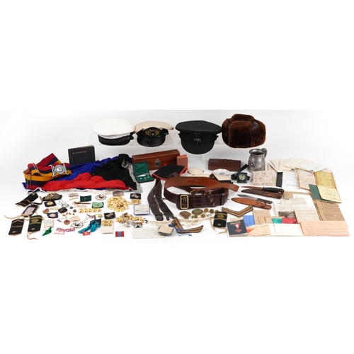 743 - A collection of military interest uniforms, paperwork, cap badges, hats and other militaria includin... 