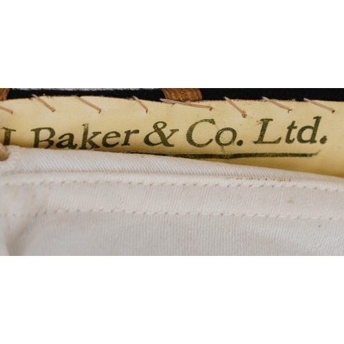 743 - A collection of military interest uniforms, paperwork, cap badges, hats and other militaria includin... 