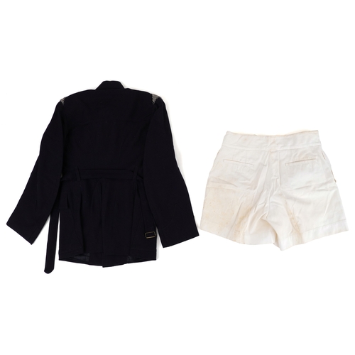 743 - A collection of military interest uniforms, paperwork, cap badges, hats and other militaria includin... 