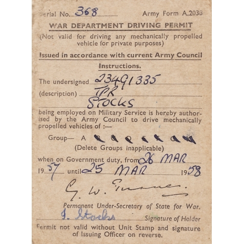 743 - A collection of military interest uniforms, paperwork, cap badges, hats and other militaria includin... 