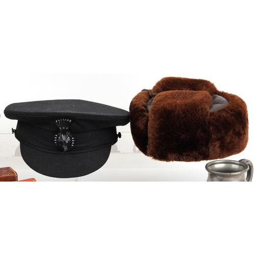 743 - A collection of military interest uniforms, paperwork, cap badges, hats and other militaria includin... 