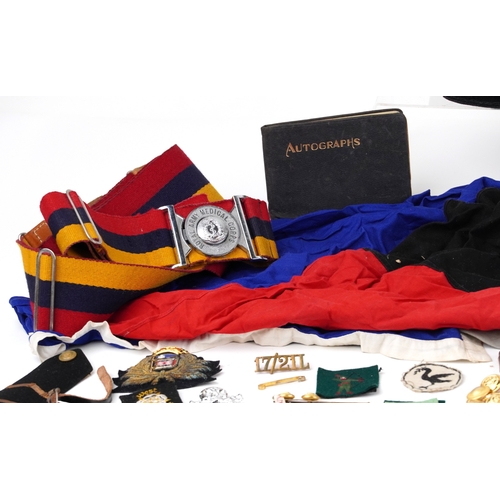 743 - A collection of military interest uniforms, paperwork, cap badges, hats and other militaria includin... 
