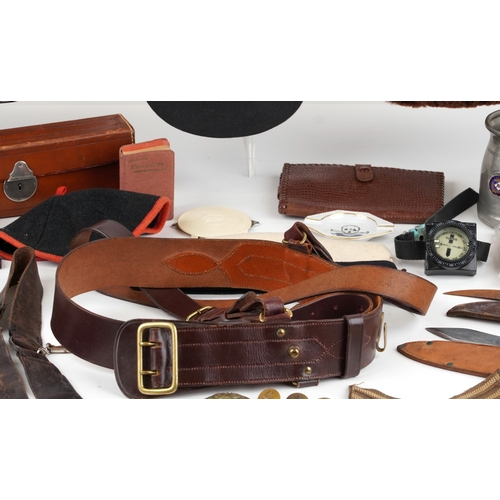 743 - A collection of military interest uniforms, paperwork, cap badges, hats and other militaria includin... 