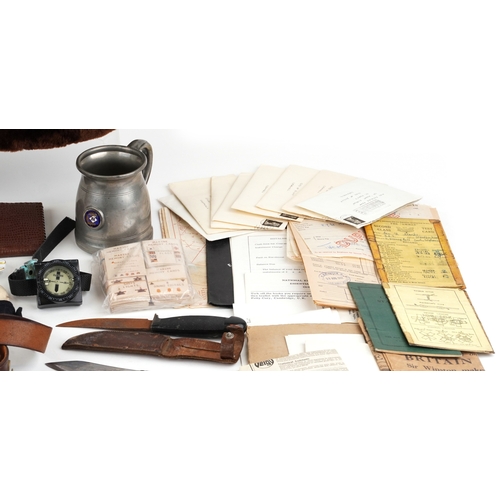 743 - A collection of military interest uniforms, paperwork, cap badges, hats and other militaria includin... 