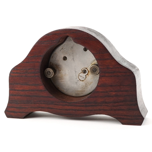 702 - Jaeger of Paris, a vintage car clock mounted in an oak stand, 19cm wide.