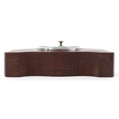 702 - Jaeger of Paris, a vintage car clock mounted in an oak stand, 19cm wide.