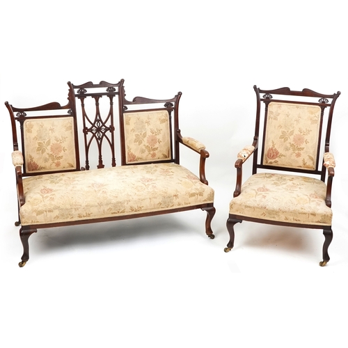 1007 - An Edwardian mahogany four piece salon suite, with carved and pierced backs, raised on cabriole legs... 