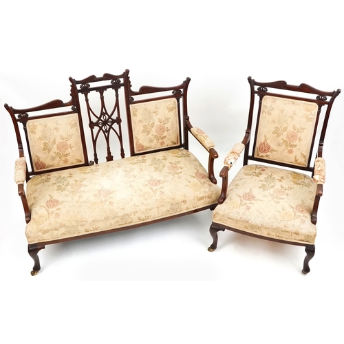 1007 - An Edwardian mahogany four piece salon suite, with carved and pierced backs, raised on cabriole legs... 