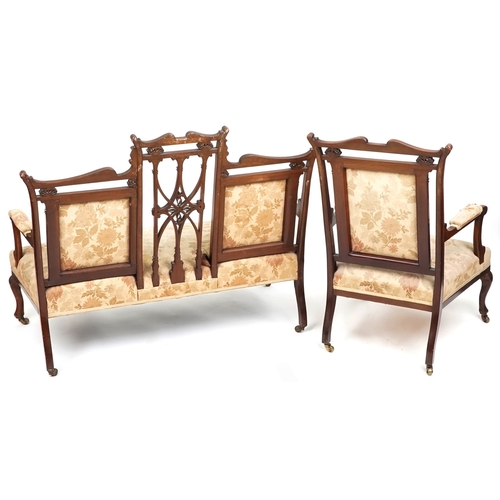 1007 - An Edwardian mahogany four piece salon suite, with carved and pierced backs, raised on cabriole legs... 