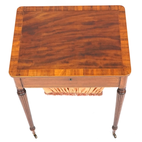1002 - A good late George III figured mahogany and rosewood crossbanded work table, the lift up back above ... 